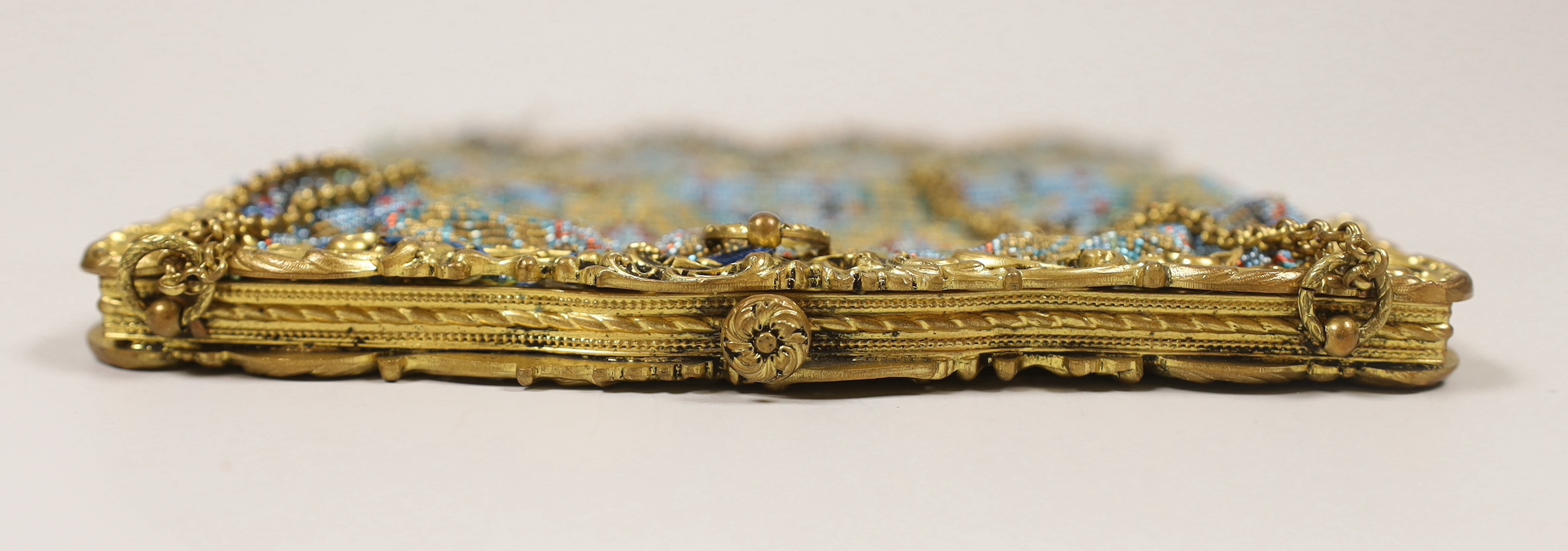 A late 19th century French gilt metal mounted coloured beaded evening bag, 17cm wide
